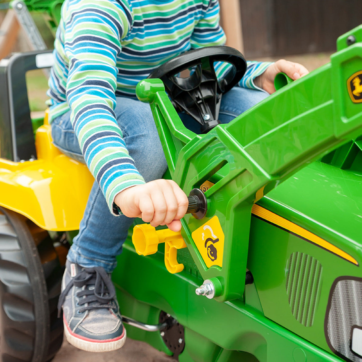 John Deere Tret-Radlader mit Heckbagger