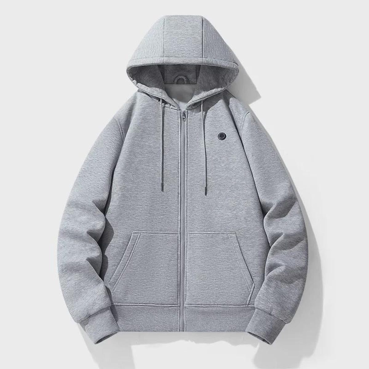 Sudadera con cremallera y calefacción integrada que te mantiene caliente sin añadir volumen