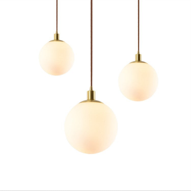 Adjustable Ceiling Pendant with Glass Shade for Entryway, Den, or Sleeping Space - Modern Suspended Fixture in White or Gold - 10 Inch Globe | Thomler