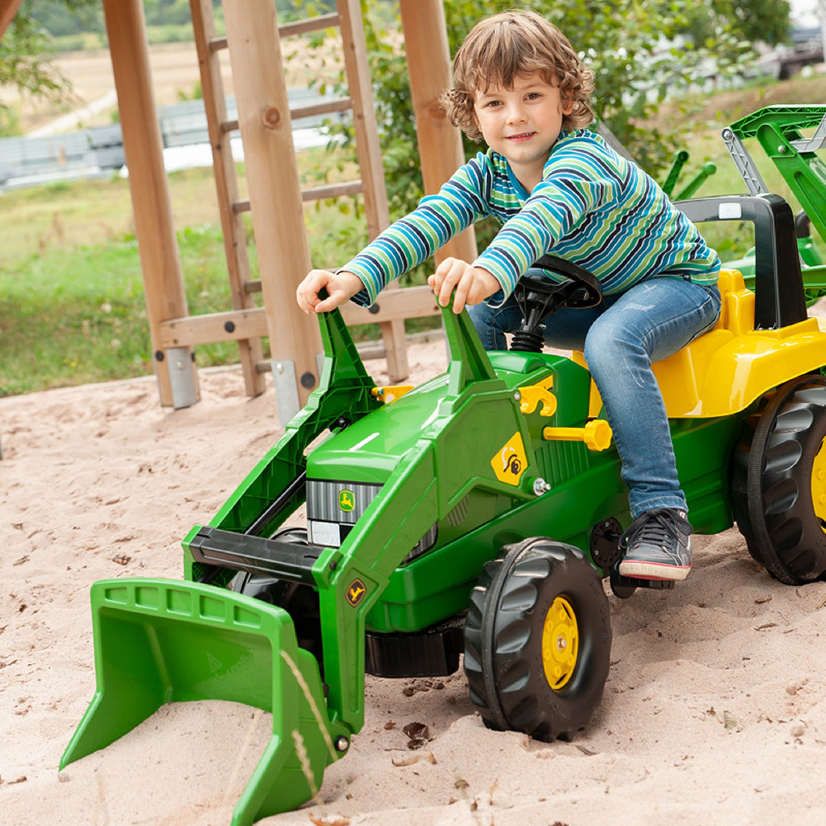 John Deere Tret-Radlader mit Heckbagger